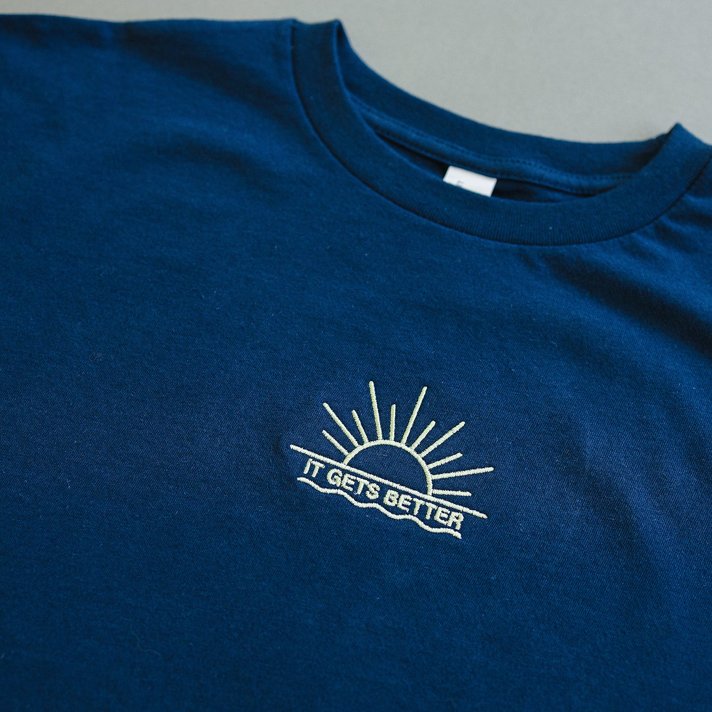 IT GETS BETTER (EMBROIDERED) TEE
